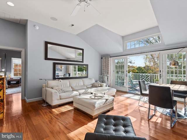 living room with ceiling fan, hardwood / wood-style floors, and a healthy amount of sunlight