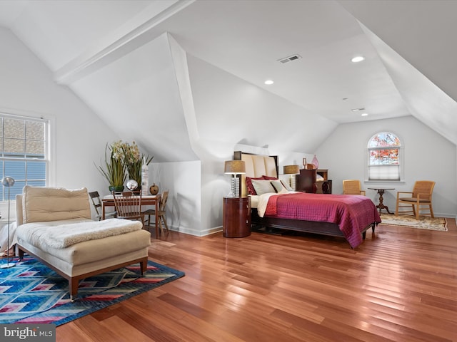 bedroom featuring vaulted ceiling and wood-type flooring