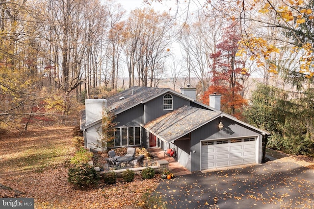 front of property with a garage