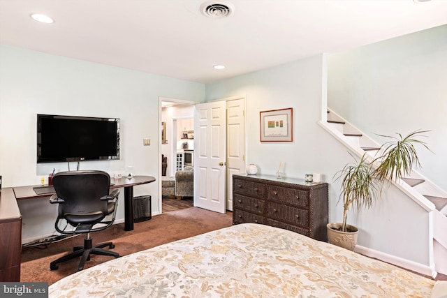 carpeted bedroom featuring a closet