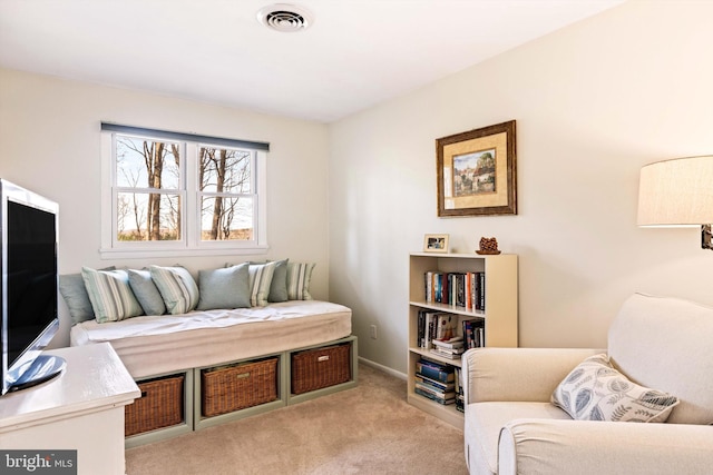 living area featuring light colored carpet