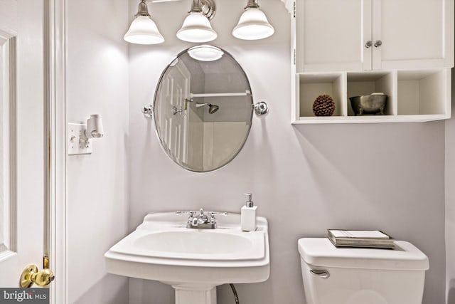 bathroom featuring sink and toilet