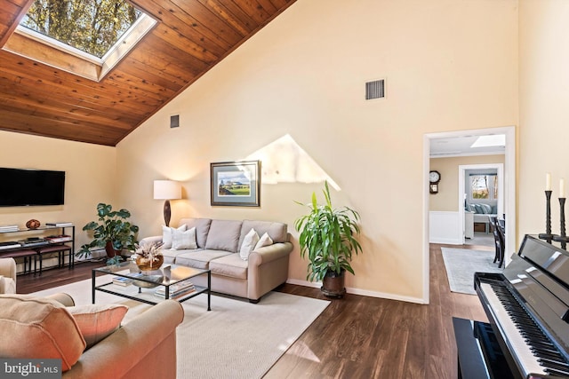 living room featuring dark wood-type flooring, high vaulted ceiling, a skylight, and wood ceiling