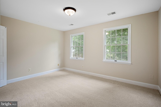 spare room featuring carpet flooring