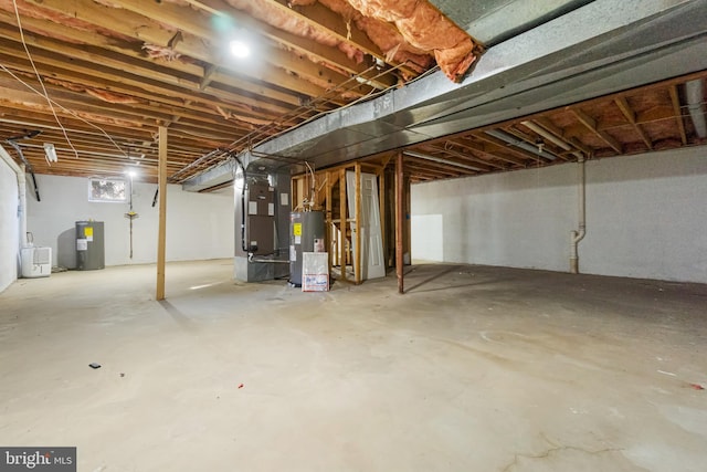 basement featuring heating unit and water heater