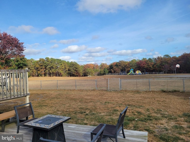 view of yard with a playground and a deck