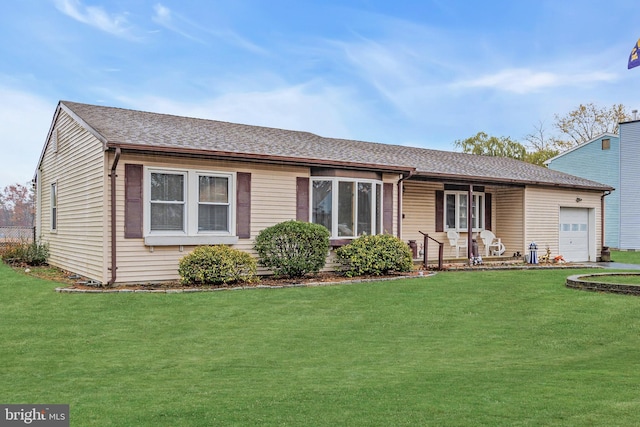 ranch-style home featuring a porch, a garage, and a front yard