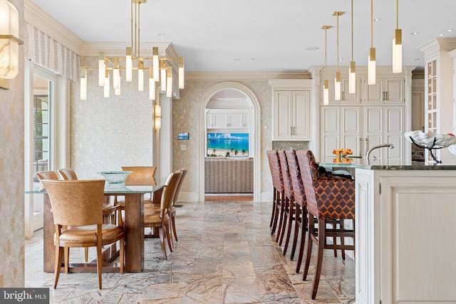 dining area featuring crown molding