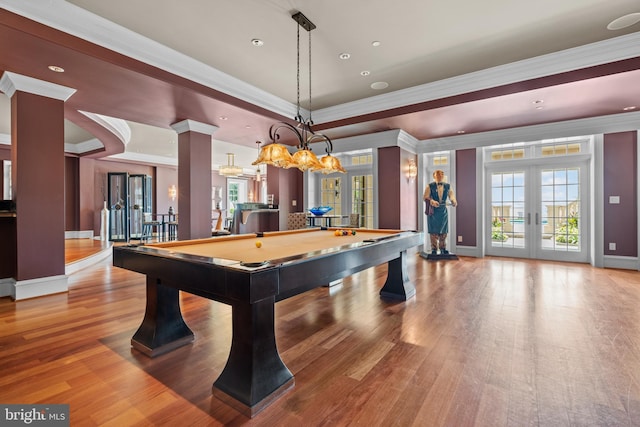 game room with light wood-type flooring, billiards, french doors, and crown molding