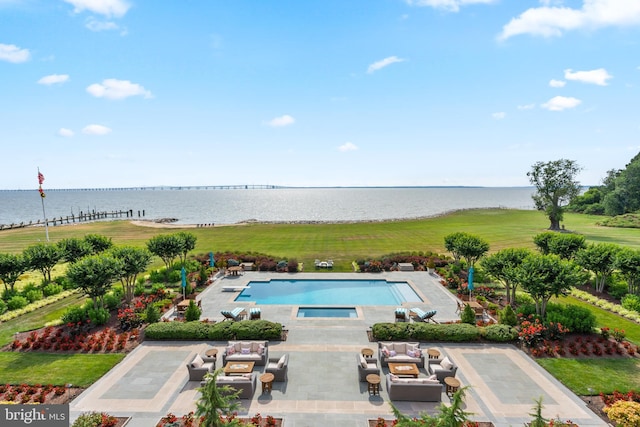 view of swimming pool with an outdoor hangout area, a water view, and a patio