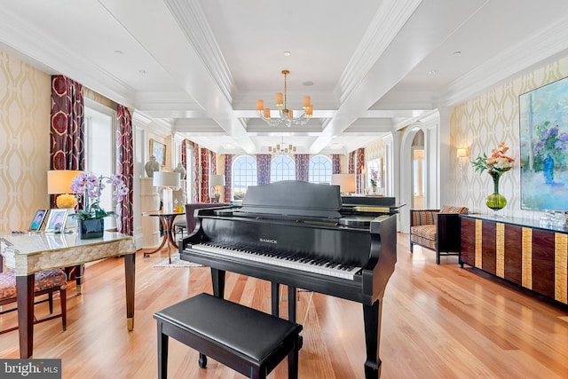 miscellaneous room with light hardwood / wood-style floors, coffered ceiling, a notable chandelier, ornamental molding, and beamed ceiling