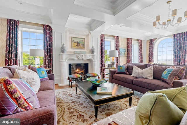 living room with plenty of natural light, beam ceiling, coffered ceiling, and a notable chandelier