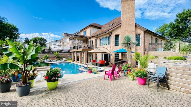 view of swimming pool featuring a patio