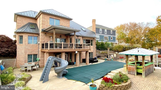 back of house with a patio area