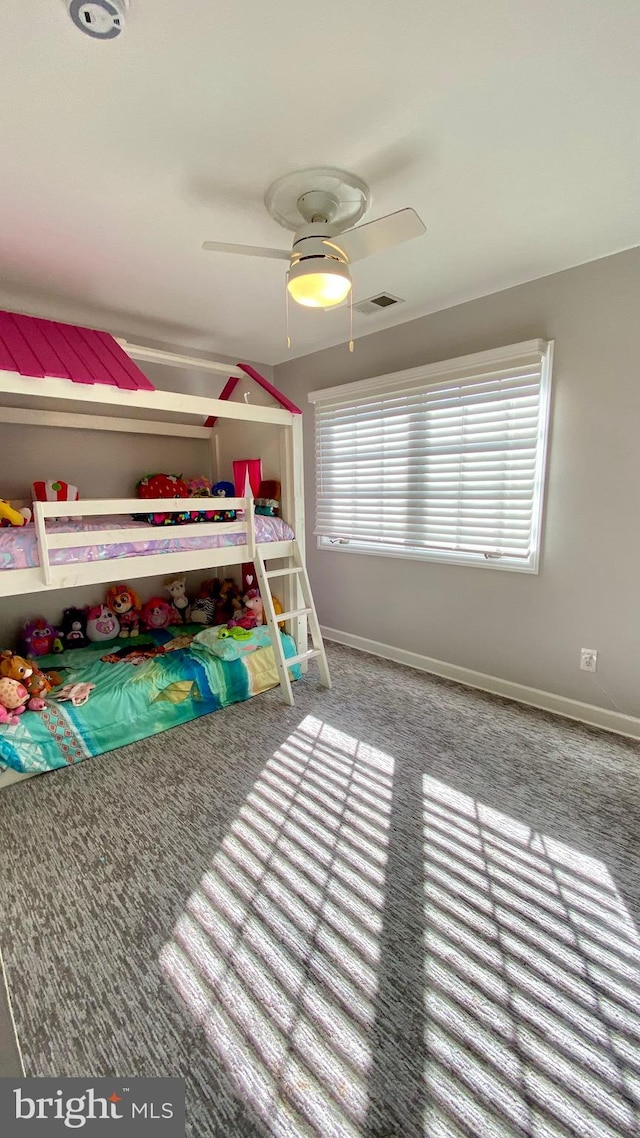 carpeted bedroom with ceiling fan