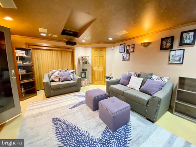 carpeted home theater with ornamental molding