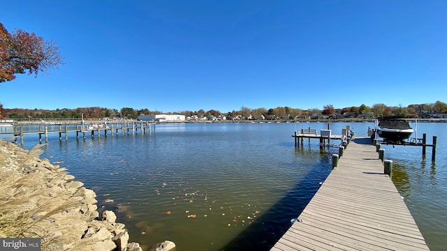 dock area featuring a water view