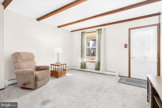 sitting room with beamed ceiling, a baseboard heating unit, and light carpet