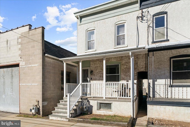 view of property with covered porch