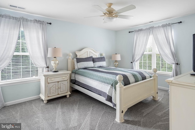 bedroom featuring ceiling fan and light carpet