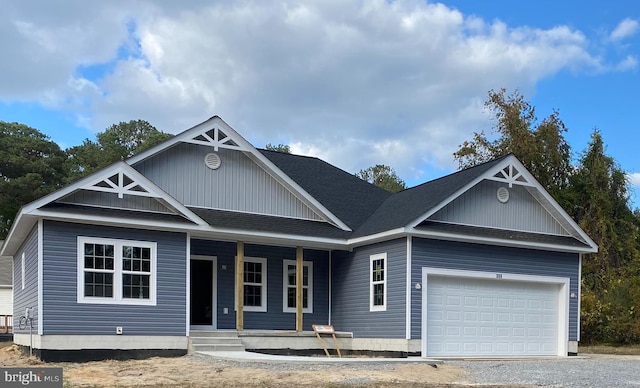 view of front of property featuring a porch and a garage