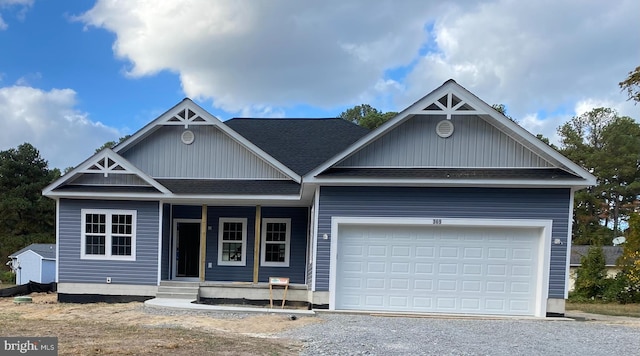 view of front of house featuring covered porch and a garage