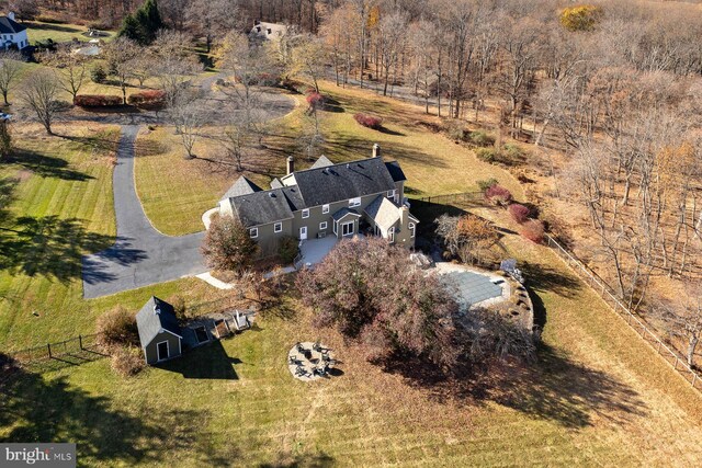 birds eye view of property featuring a rural view