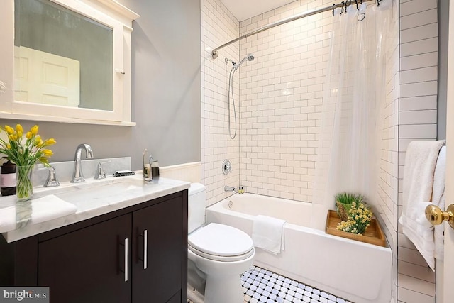 full bathroom with tile patterned flooring, vanity, toilet, and shower / bath combination with curtain