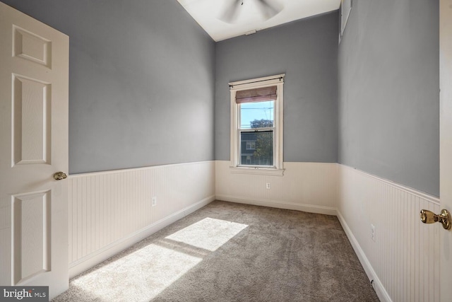 spare room with light colored carpet