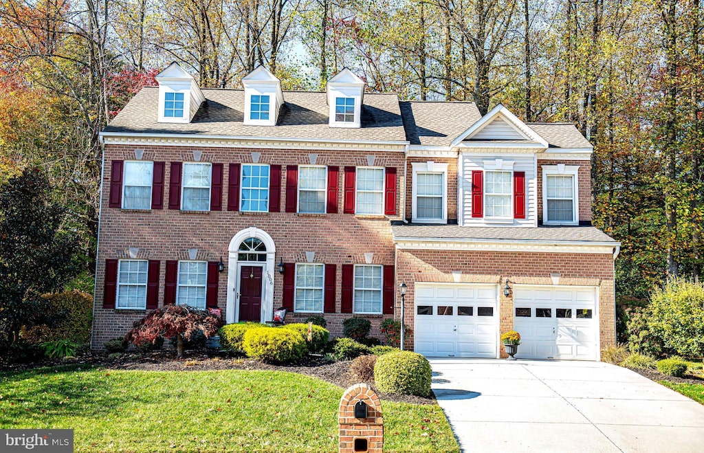 view of front facade featuring a garage and a front yard