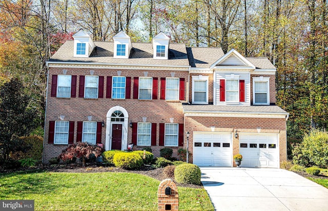 view of front facade featuring a garage and a front yard