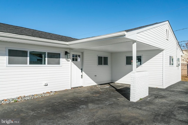 exterior space with a carport