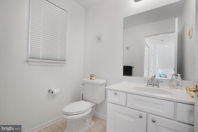 bathroom featuring tile patterned floors, vanity, and toilet