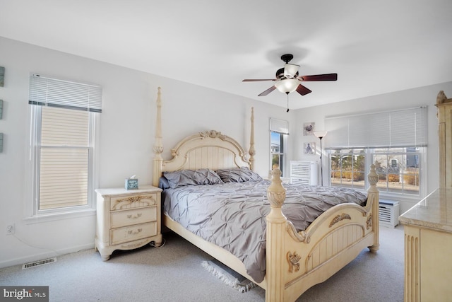 bedroom featuring ceiling fan and light colored carpet