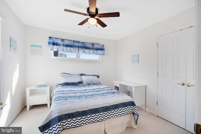 carpeted bedroom featuring ceiling fan