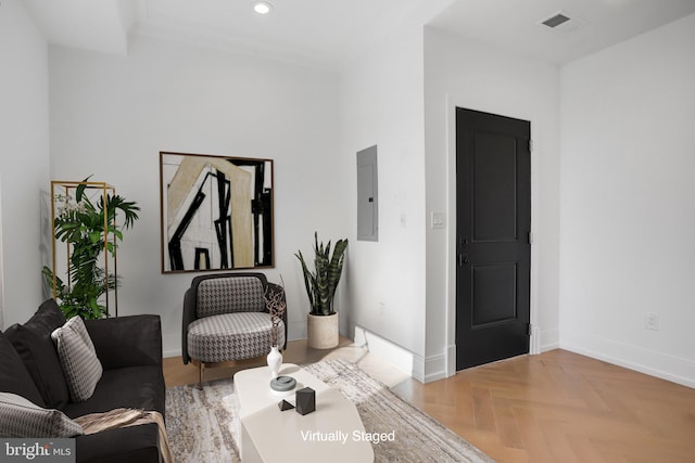 sitting room featuring electric panel and parquet flooring