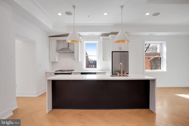 kitchen featuring white cabinets, a wealth of natural light, and appliances with stainless steel finishes