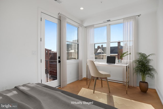 bedroom with light parquet floors