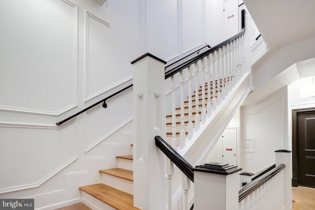 stairway featuring hardwood / wood-style floors