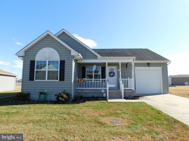 view of front of house featuring a garage, covered porch, and a front yard