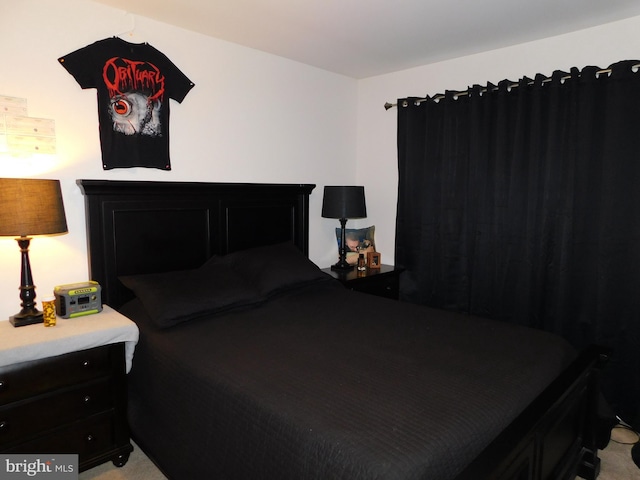 bedroom with light colored carpet