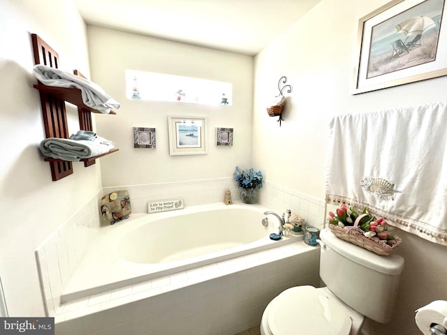 bathroom with tiled bath and toilet