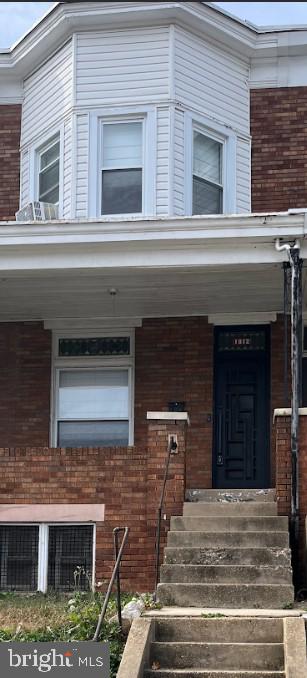 property entrance with a porch and central AC unit