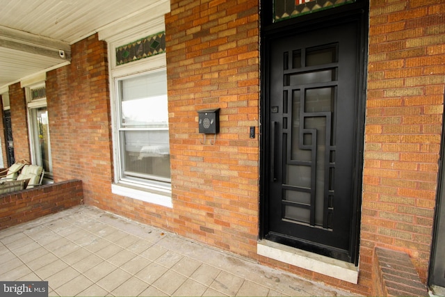 view of exterior entry featuring a porch