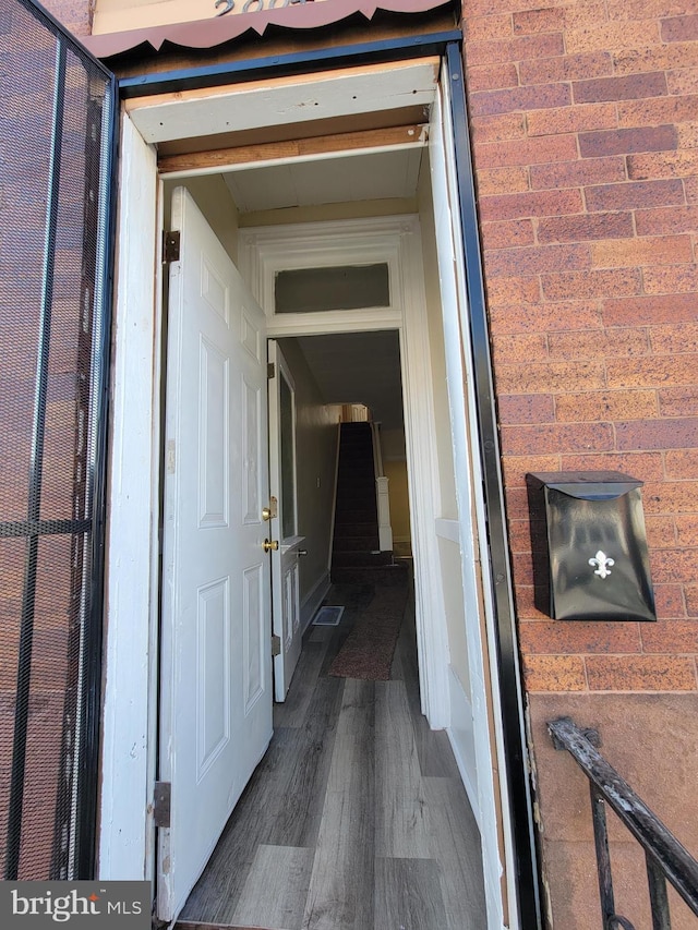 hallway featuring dark hardwood / wood-style floors