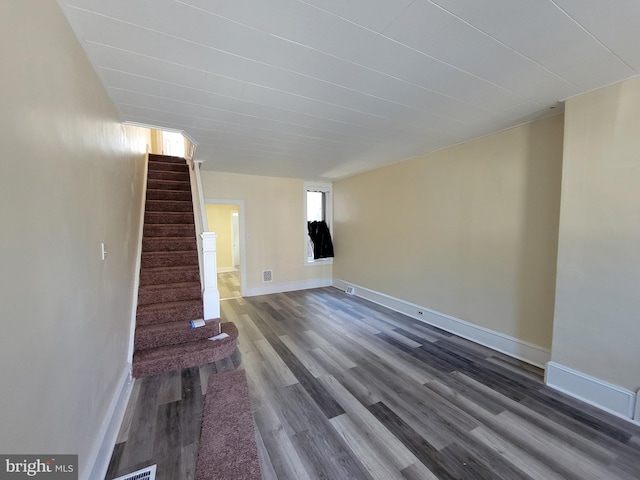 unfurnished living room featuring hardwood / wood-style floors