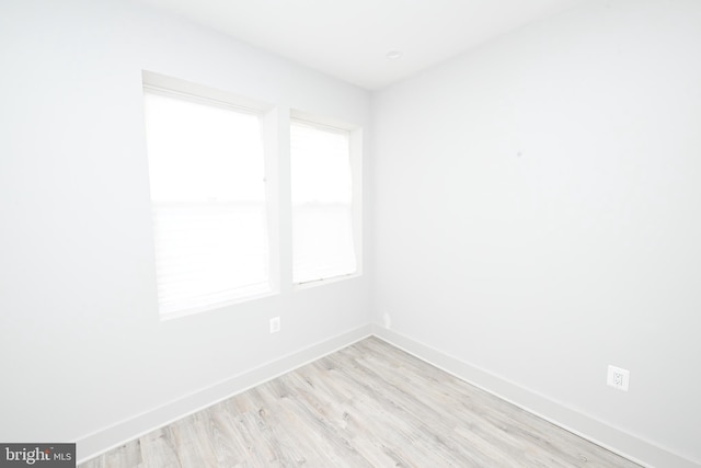 empty room with light wood-type flooring