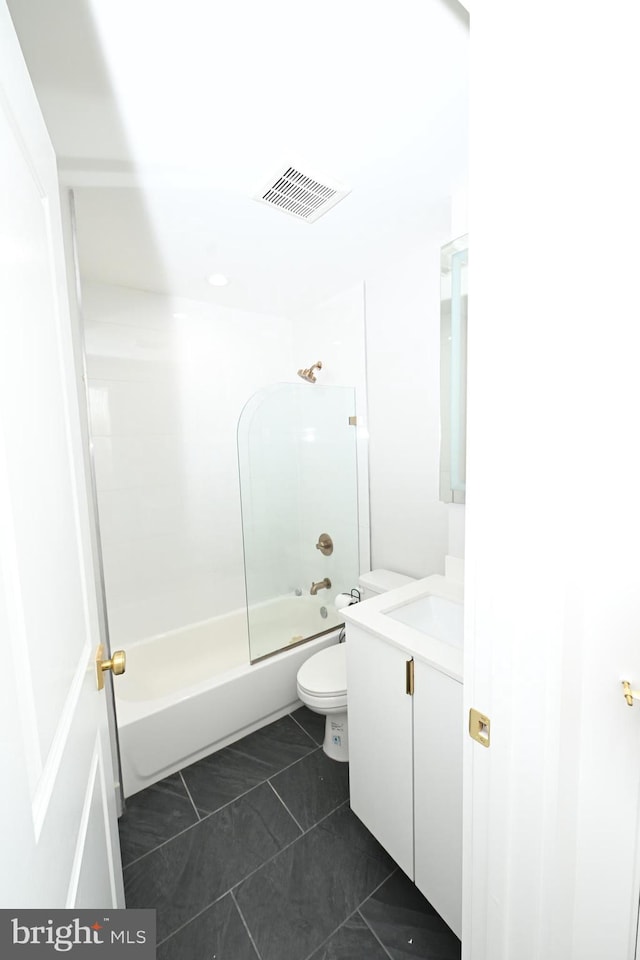 full bathroom featuring toilet, vanity, shower / bath combination, and tile patterned floors