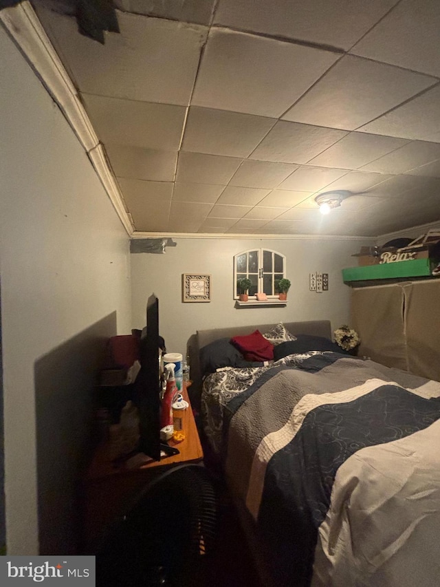 bedroom with a paneled ceiling