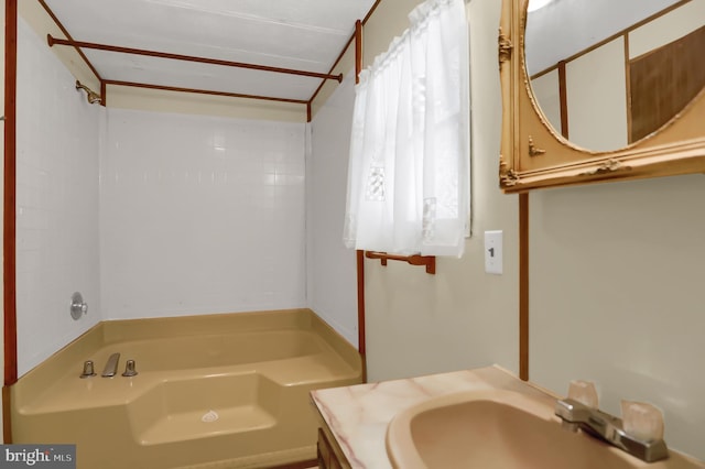 bathroom featuring plus walk in shower and vanity